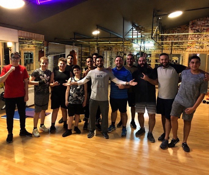 Mah Ghasemi with a training group in the gym