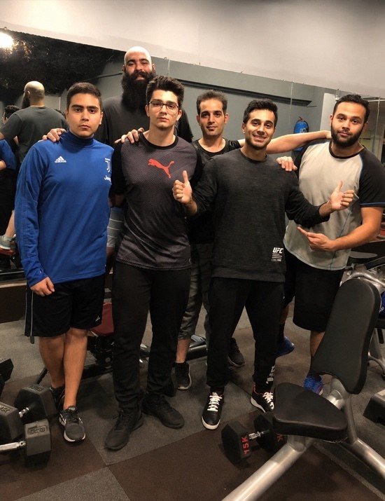A training group photographed together in the gym