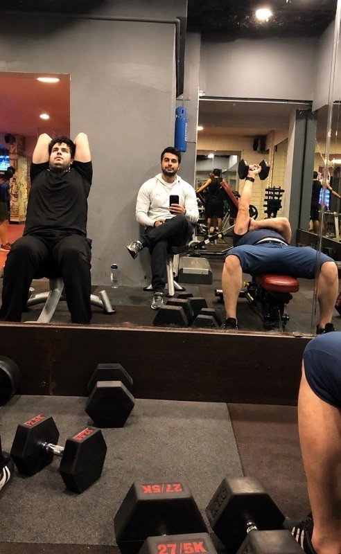 Clients training on the gym floor